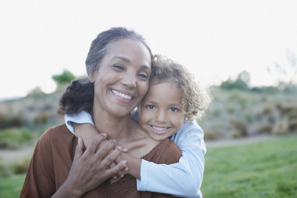 Boy hugging grandmother Boy hugging smiling grandmother happy general dentistry in Brantford is available
