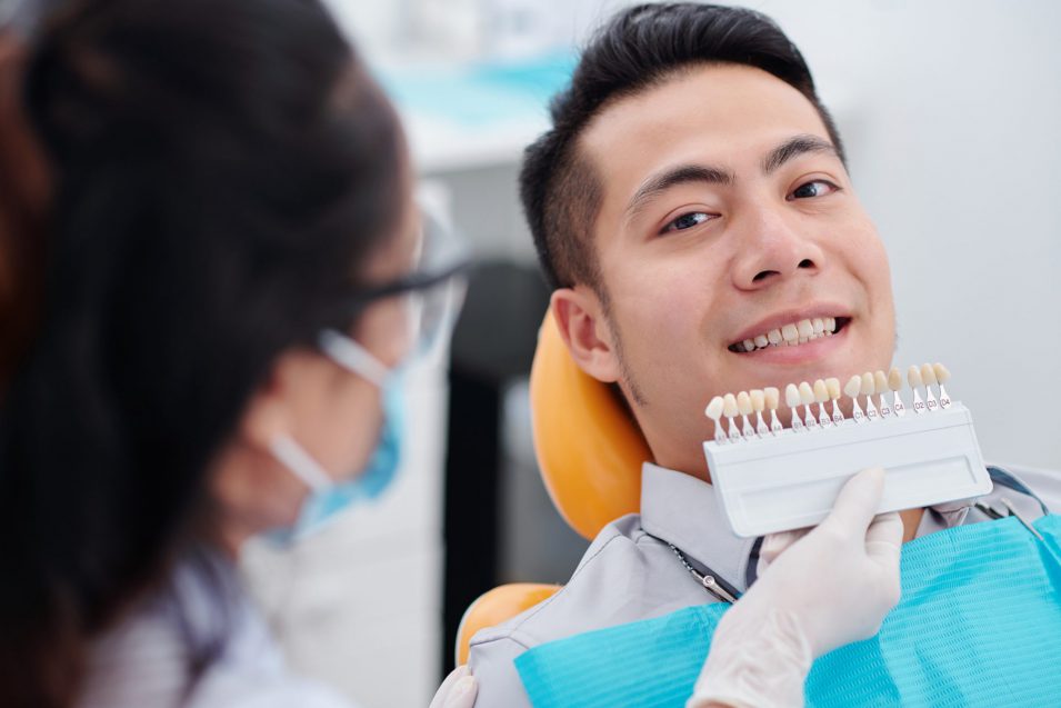 dentist discusses with patient treatment options for veneers in Brantford