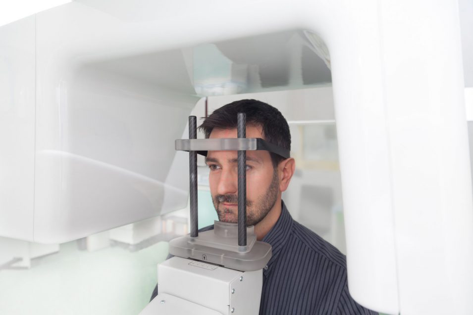 a young man given a CBCT Scan a modern dental technology in Brantford