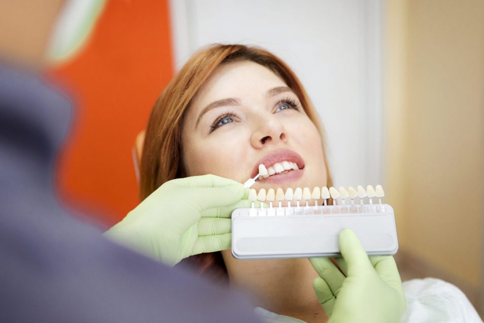 dentist discusses with girl procedure of dental veneers in Brantford