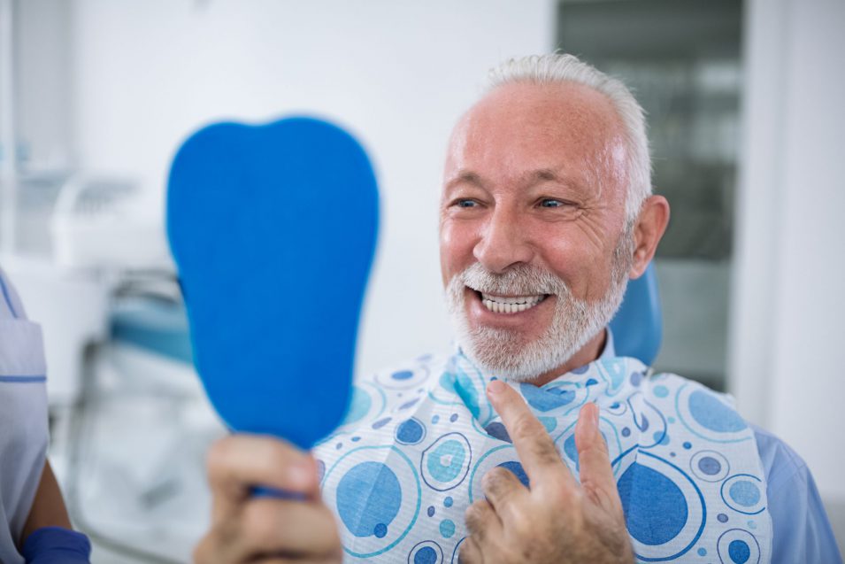 Smiling and satisfied patient after dental inlays and onlays treatment in Brantford