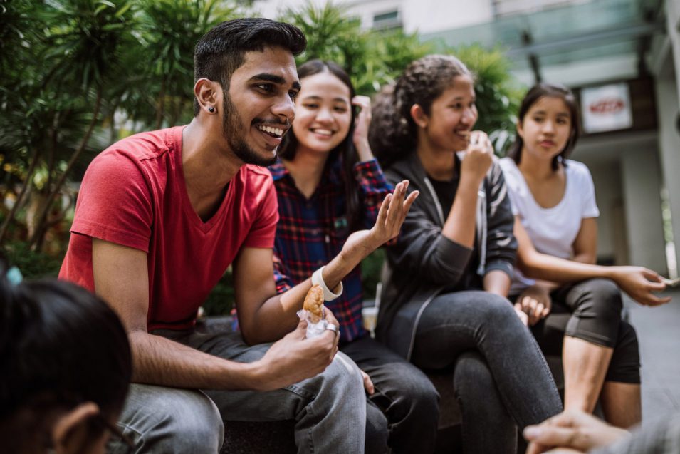 Group Of Students Joking And Getting To Know Each Other